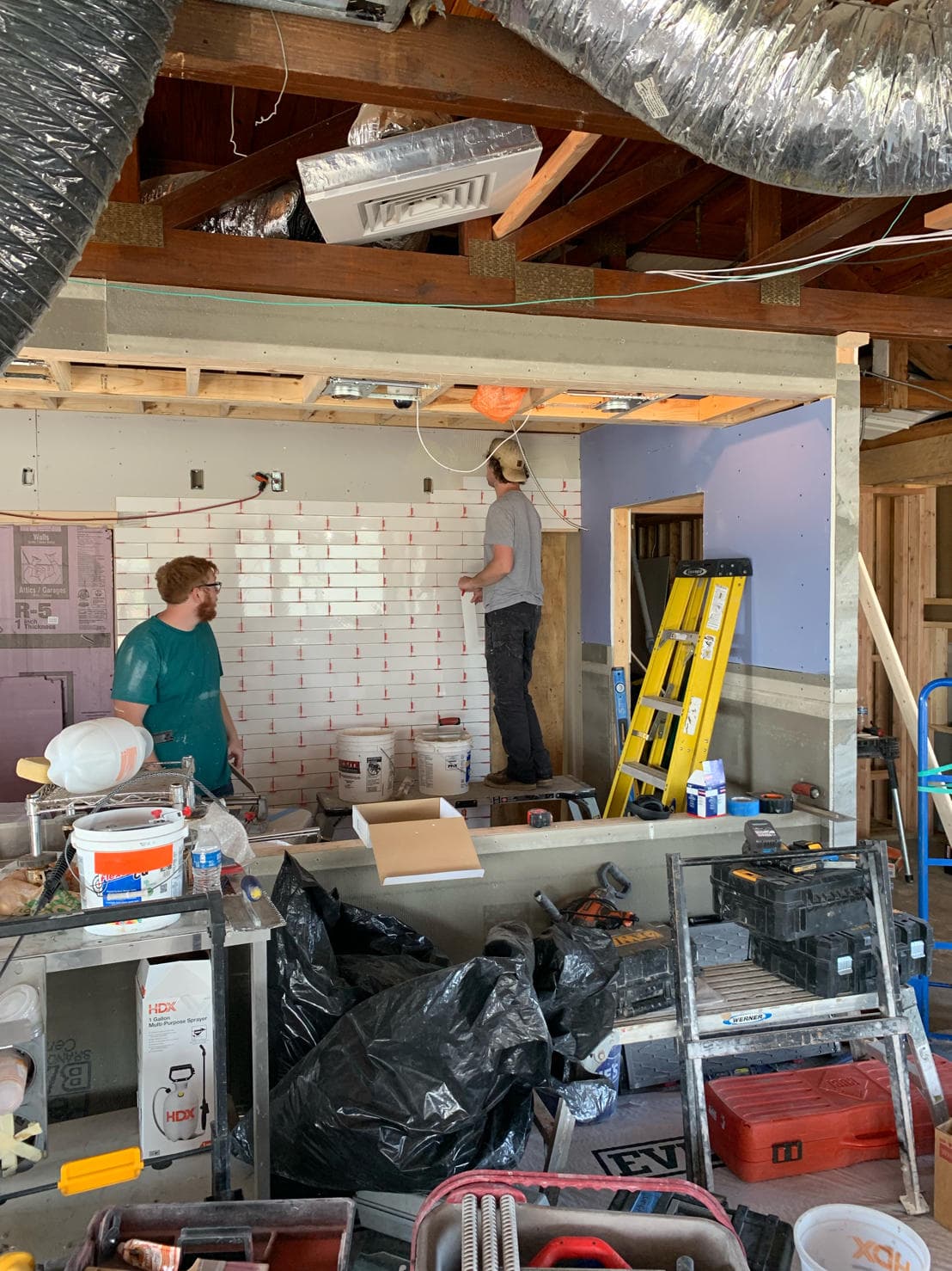 Restaurant floor tile installation in progress by Sisson Tile crew by Sisson Tile