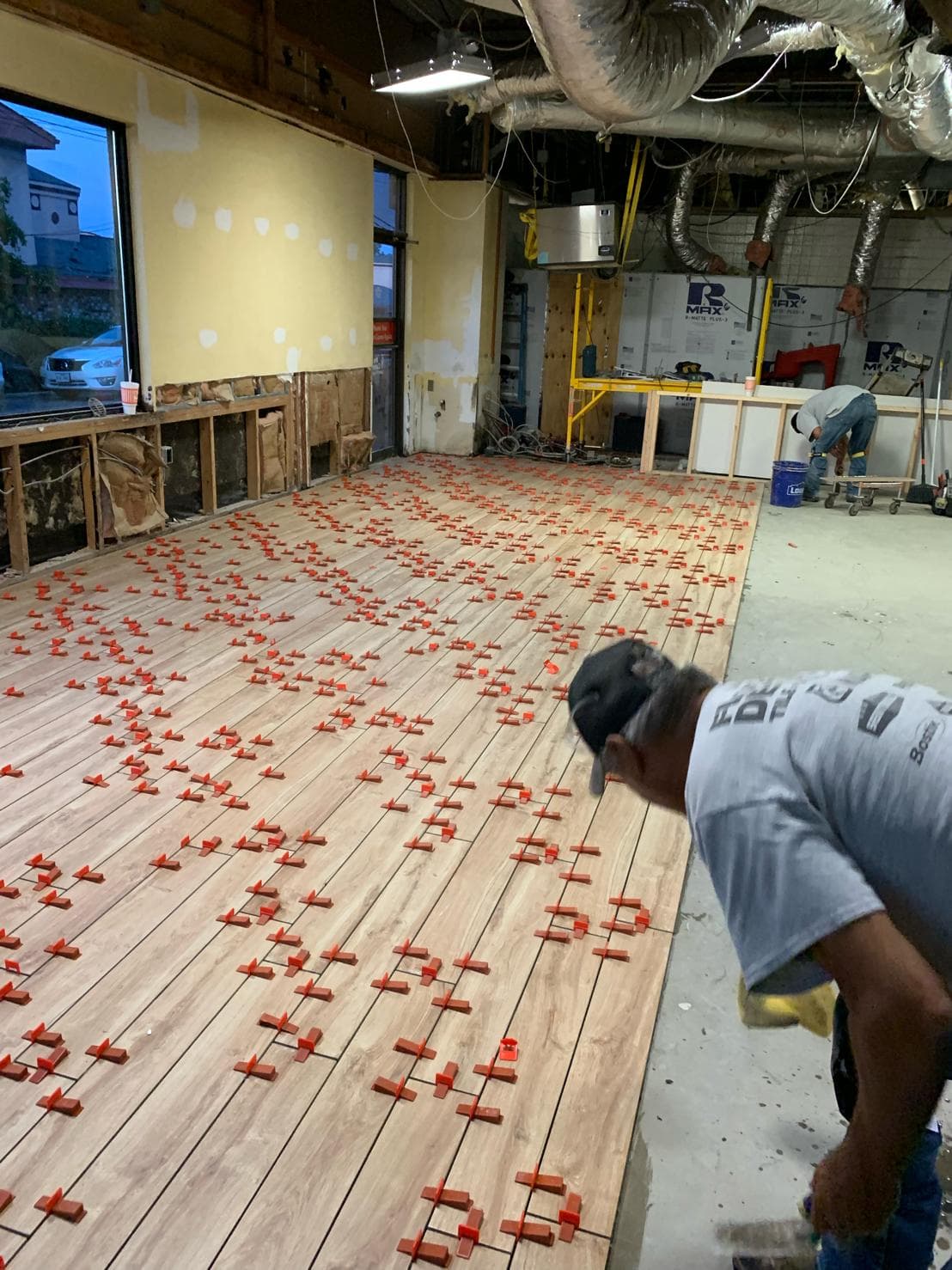 Large-format floor tile installation — commercial project by Sisson Tile