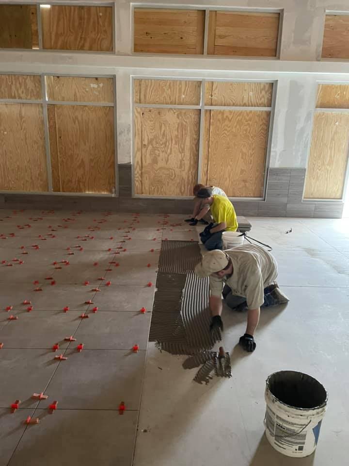 Restaurant floor tile installation in progress by Sisson Tile crew by Sisson Tile
