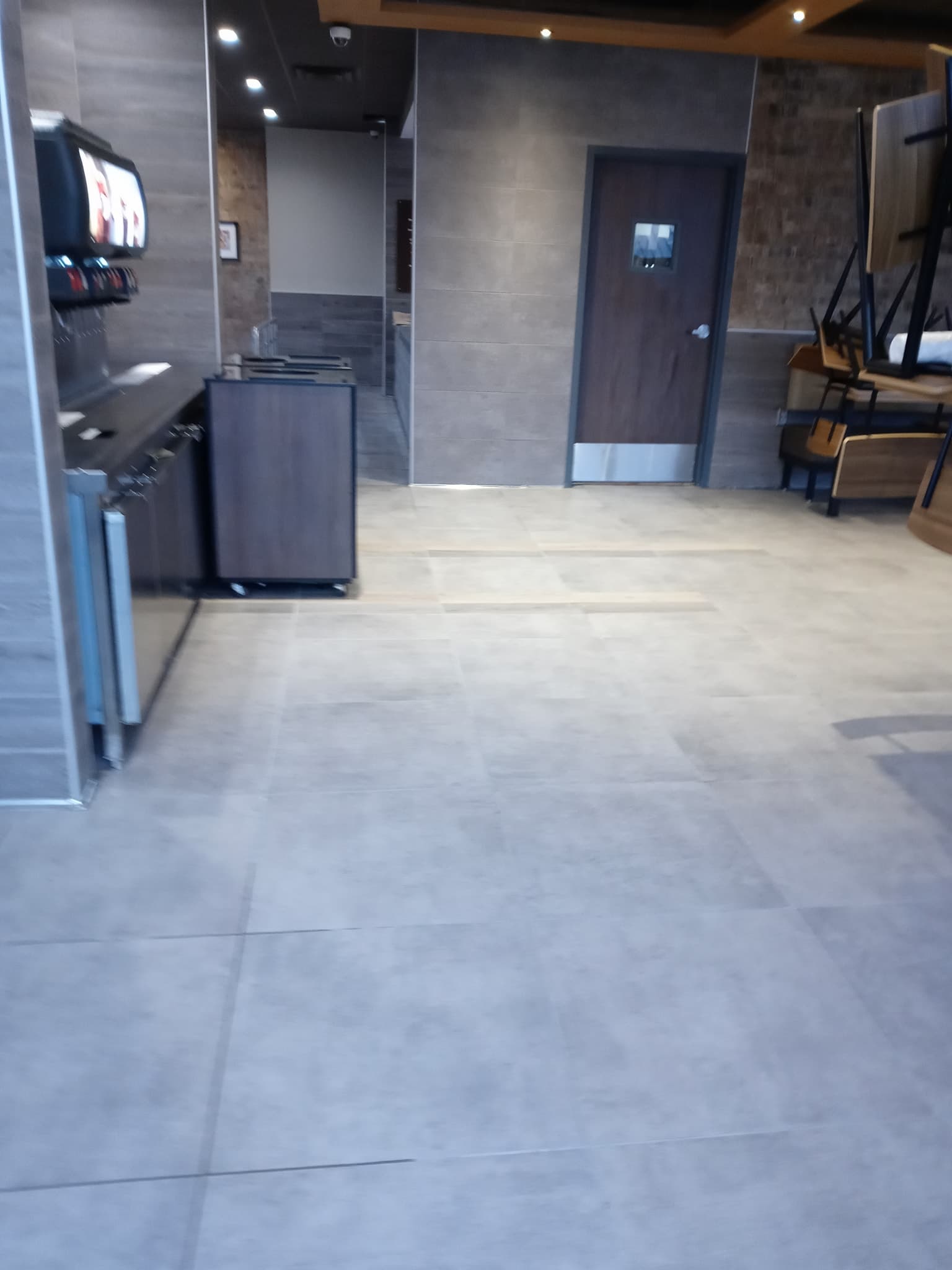 Restaurant floor tile installation in progress by Sisson Tile crew by Sisson Tile