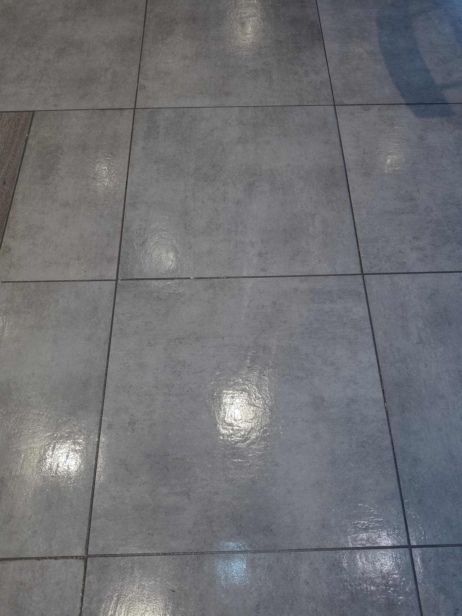 Tile installation in progress — Sisson Tile crew on active commercial job site by Sisson Tile