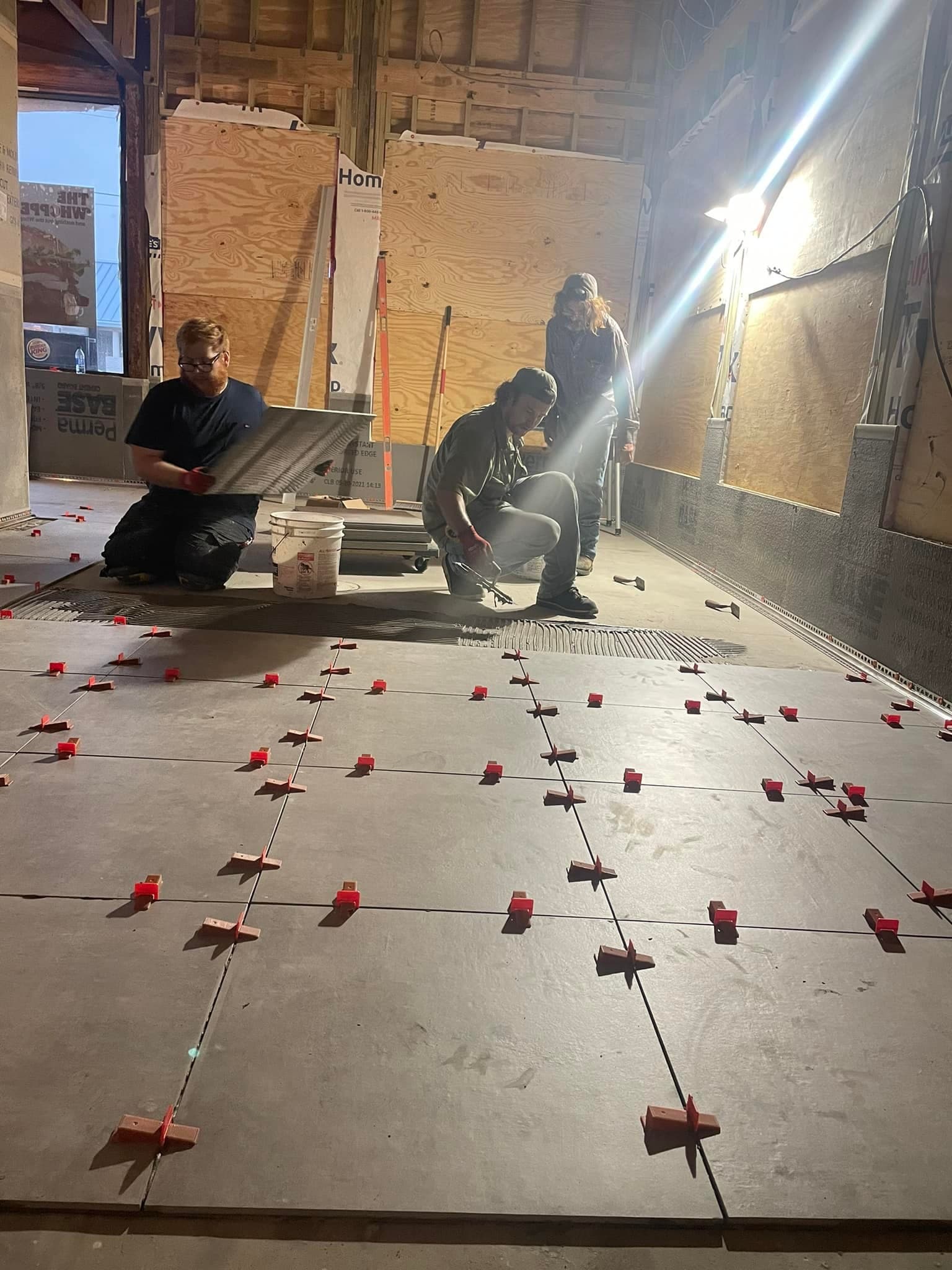 Large-format floor tile installation — commercial project by Sisson Tile