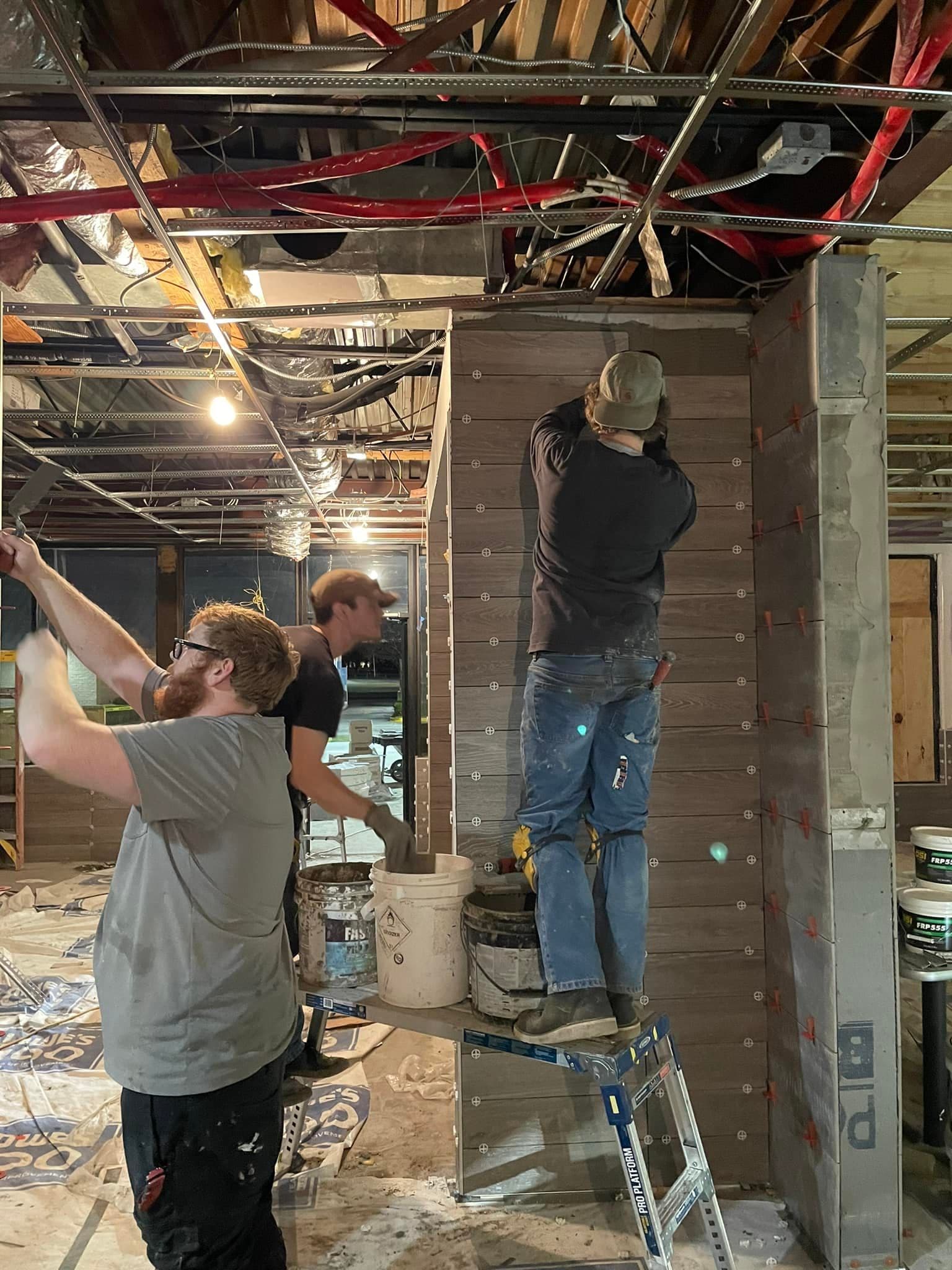 Restaurant floor tile installation in progress by Sisson Tile crew by Sisson Tile