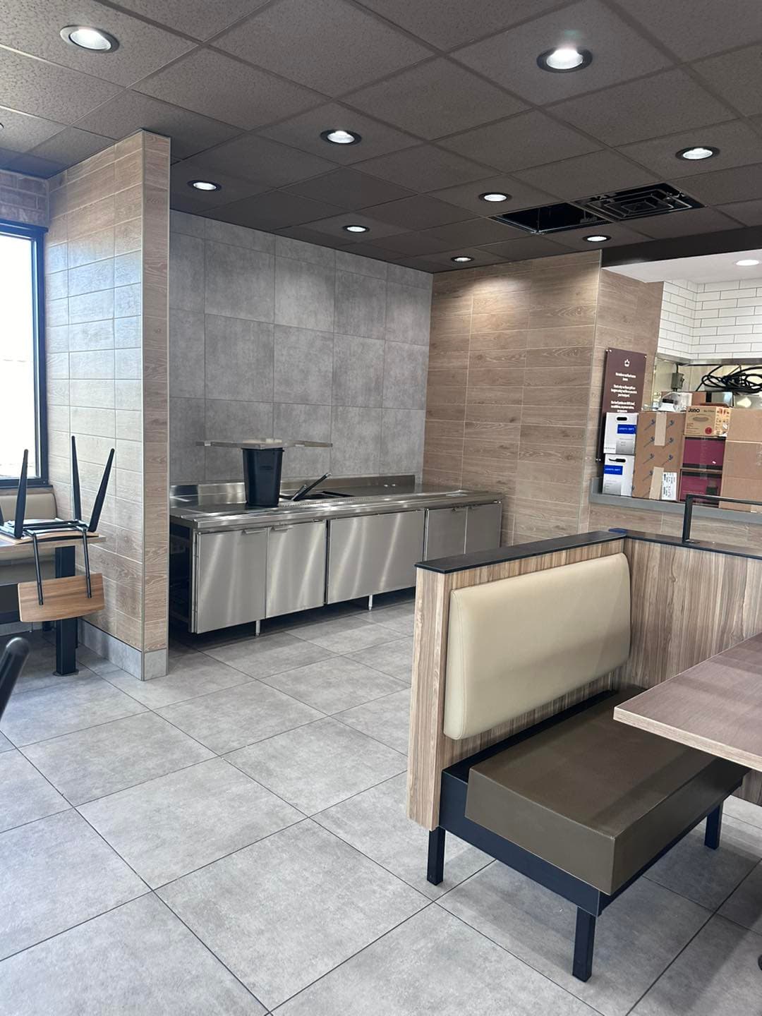 Tile installation in progress — Sisson Tile crew on active commercial job site by Sisson Tile