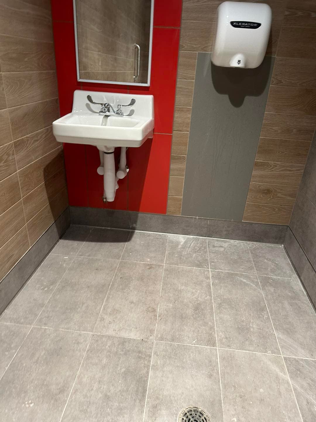 Large-format floor tile installation — commercial project by Sisson Tile