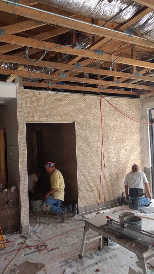 Large-format floor tile installation — commercial project by Sisson Tile