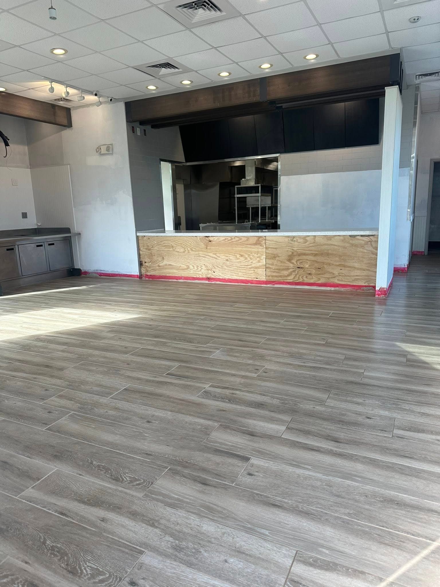 Finished commercial tile floor — large format, clean lines, Sisson Tile by Sisson Tile