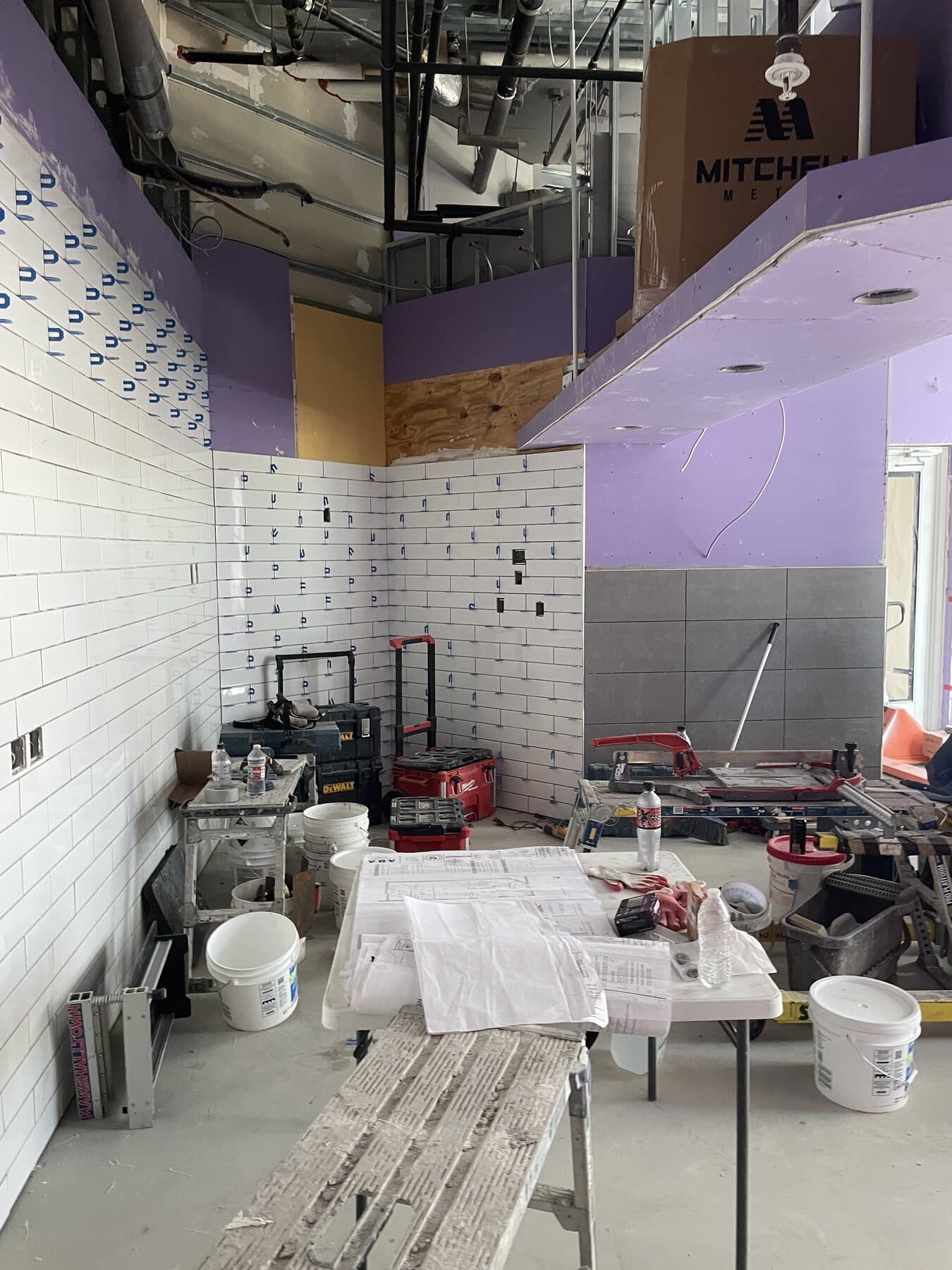 Large-format floor tile installation — commercial project by Sisson Tile