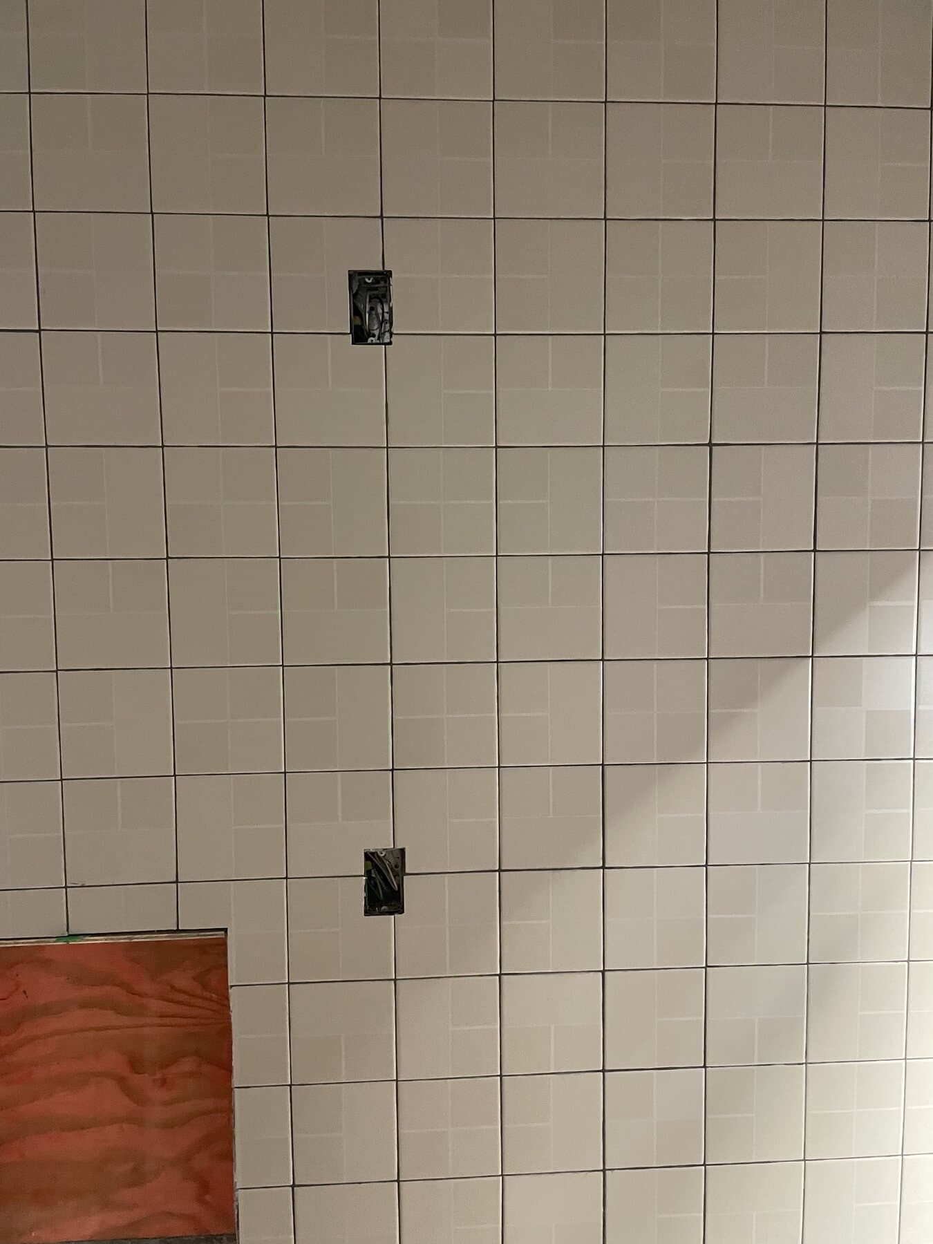 Tile installation in progress — Sisson Tile crew on active commercial job site by Sisson Tile