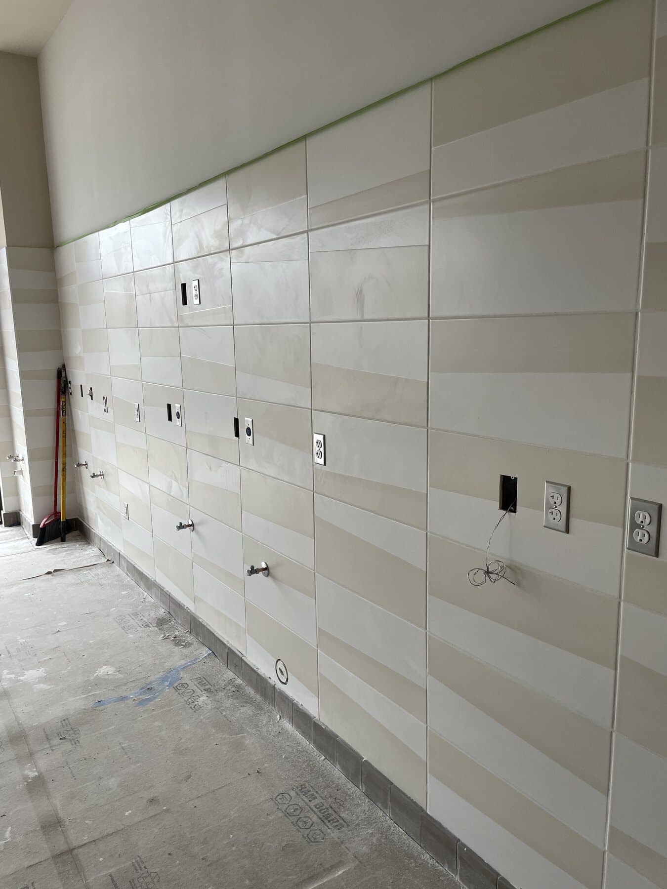 Large-format floor tile installation — commercial project by Sisson Tile