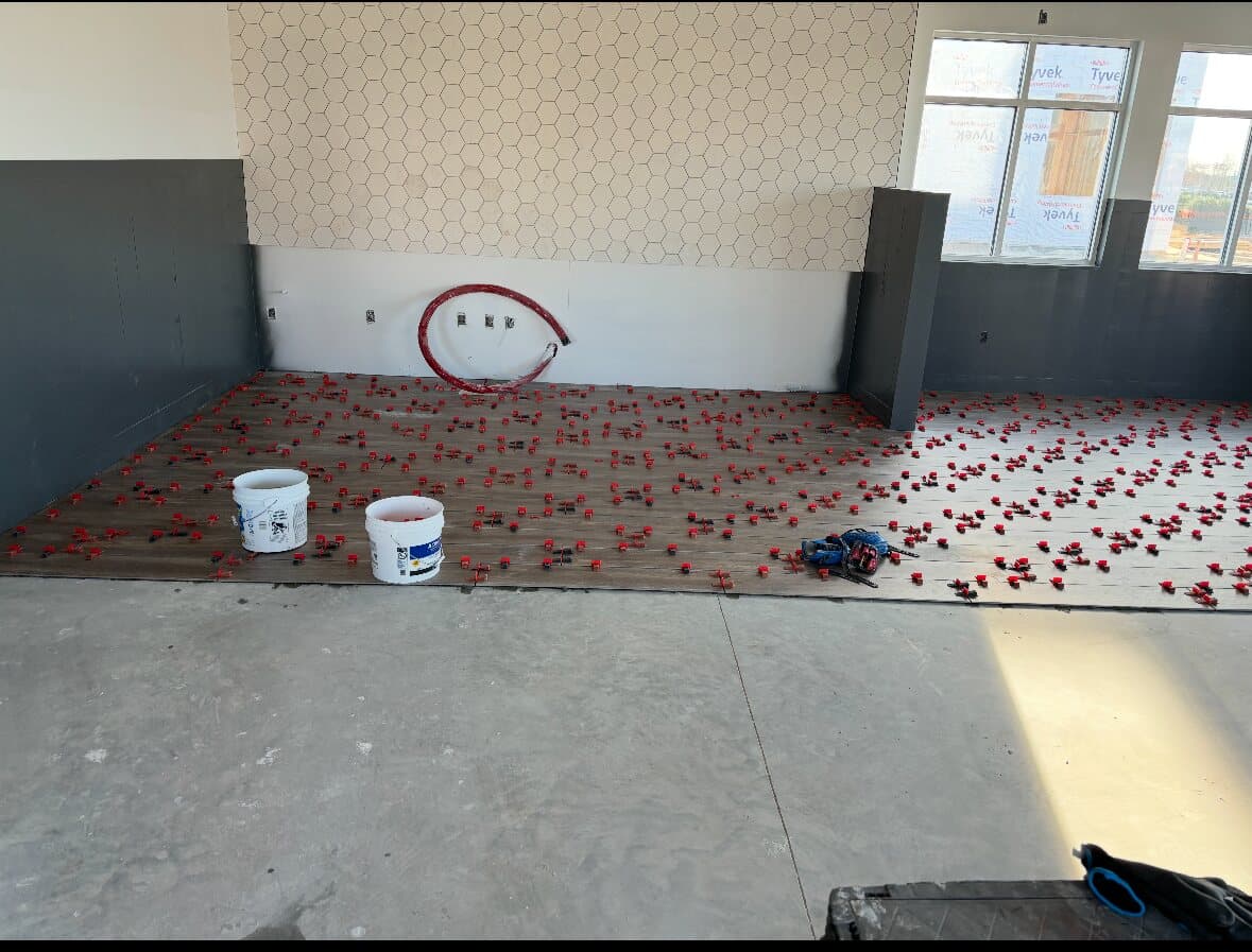 Tile prep and layout on commercial job site by Sisson Tile crew by Sisson Tile
