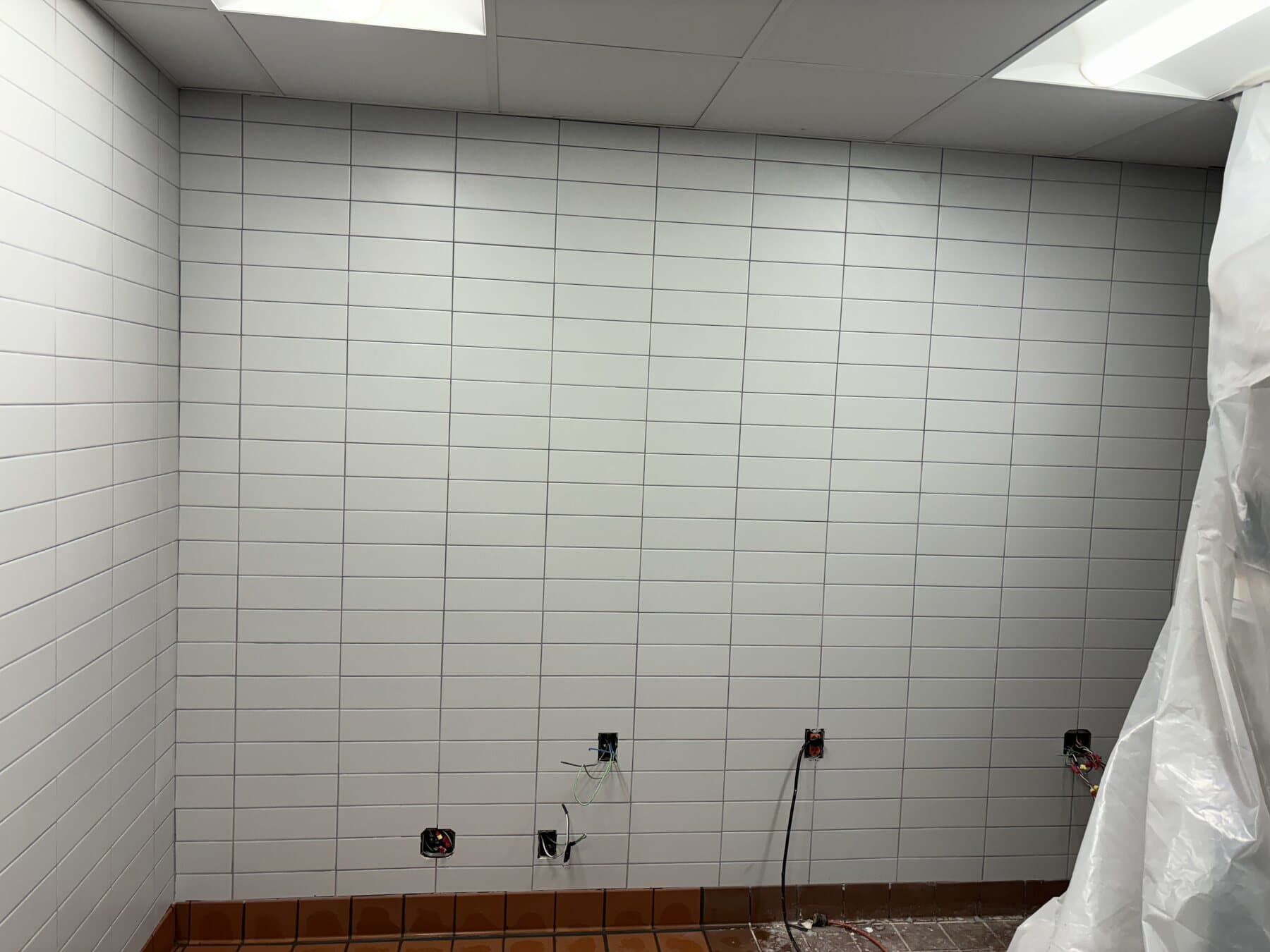 Restaurant floor tile installation in progress by Sisson Tile crew by Sisson Tile
